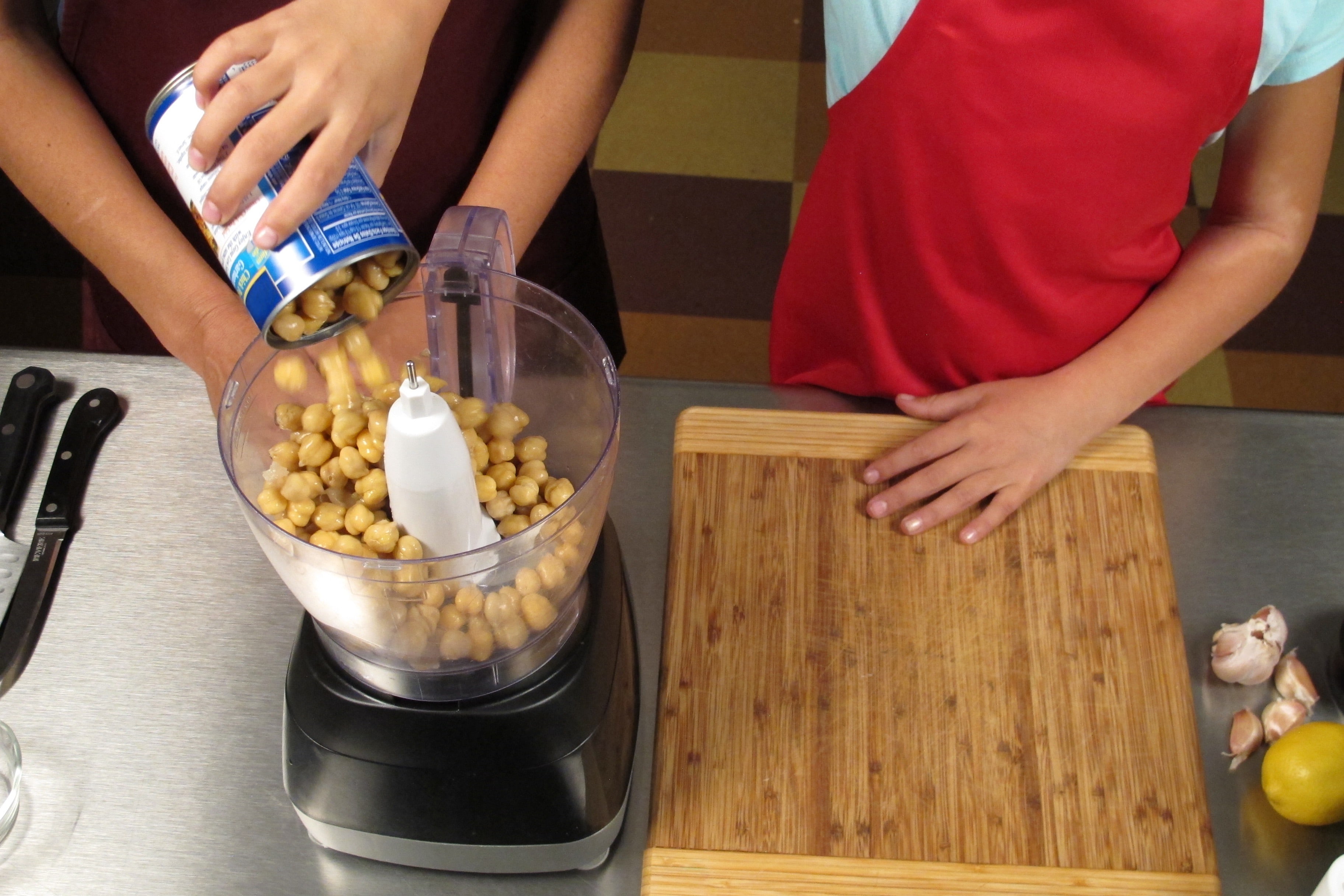 Place garbanzo beans into electric blender or food processor.