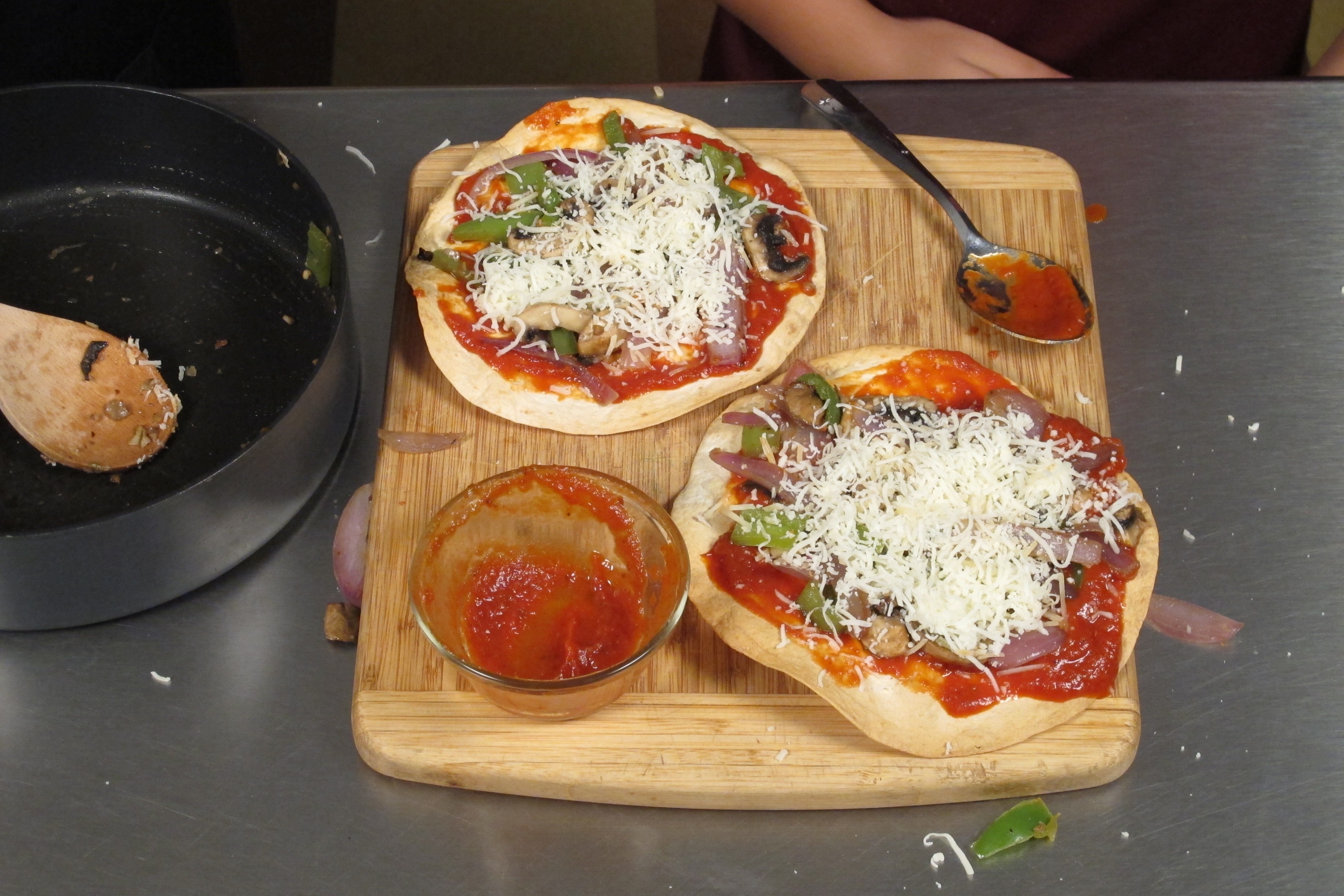 Spread 2 tablespoons mozzarella cheese and ½ teaspoon of Parmesan cheese onto each tortilla crust.
